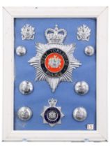 A collection of West Yorkshire Police badges and insignia