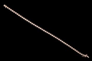 A contemporary diamond tennis bracelet, having 50 brilliant cut diamonds each claw set on an open