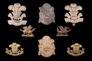 A group of volunteer and territorial Welsh Regiment cap and collar badges