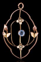 An early 20th Century pearl, blue paste and yellow metal openwork pendant, (tested as 9 ct gold),