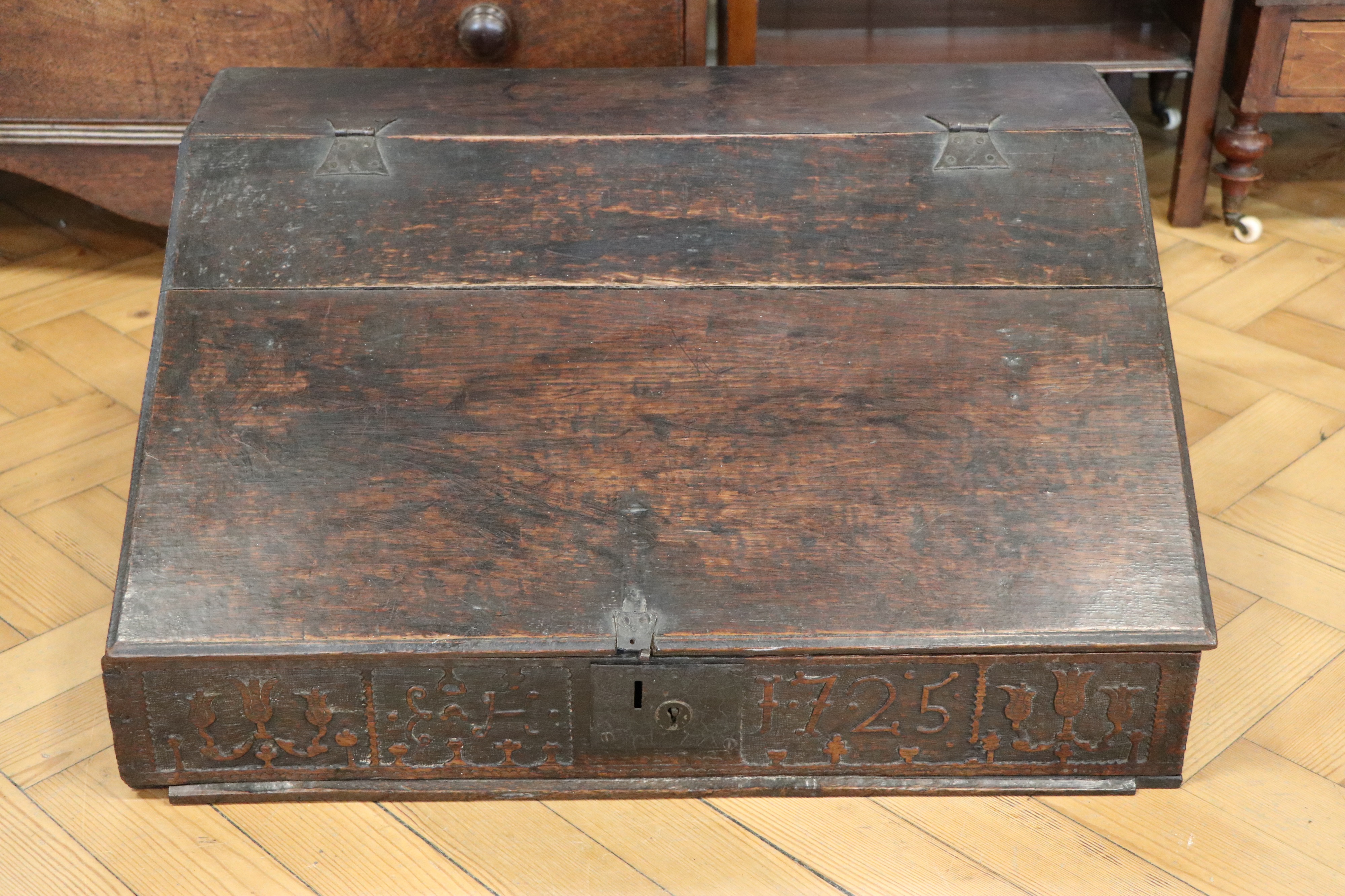A George I Westmorland carved oak desk box, dated 1725, 66 cm x 47 cm x 30 cm