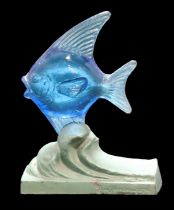 An Art Deco cast spelter and Bermondsey Glass Co. moulded blue glass fish bookend, designed by Guy