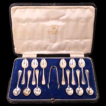A cased set of twelve Edwardian silver tea spoons with sugar tongs, James Deakin & Sons (John &