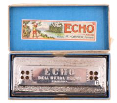 A 1920s M Hohner "The Echo" harmonica, in original carton