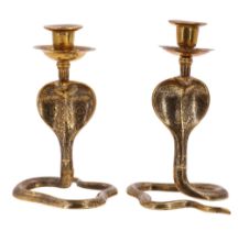 A pair of Indian brass candlesticks in the form of cobras, height 18 cm