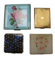 Four early-to-mid 20th Century powder compacts including a 1920s embroidered example