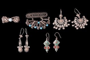 A group of turquoise, coral and white metal filigree ear pendants and brooches