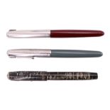 Two vintage Parker 51 fountain pens together with a similar Parker Vacumatic fountain pen