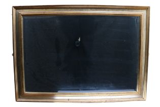A contemporary bevelled edge mirror in moulded gilt frame, 106 cm x 76 cm