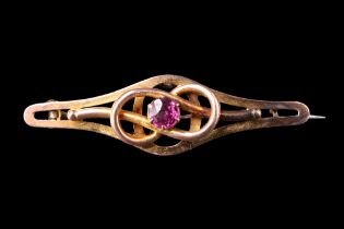 A late 19th / early 20th Century pink gemstone and 9 ct gold brooch, the facet-cut stone of approx 5