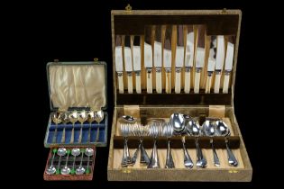 A group of boxed chromium plated and other flatware including coffee "bean" spoons, etc