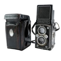 A cased Rolleiflex Compur-Rapid 120 mm film camera mounted with Heidoscop-Anastigmat 1:28 and Carl