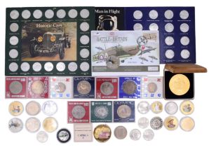 A group of commemorative coins and exonumia including a 2007 gold-plated silver Henry VIII five