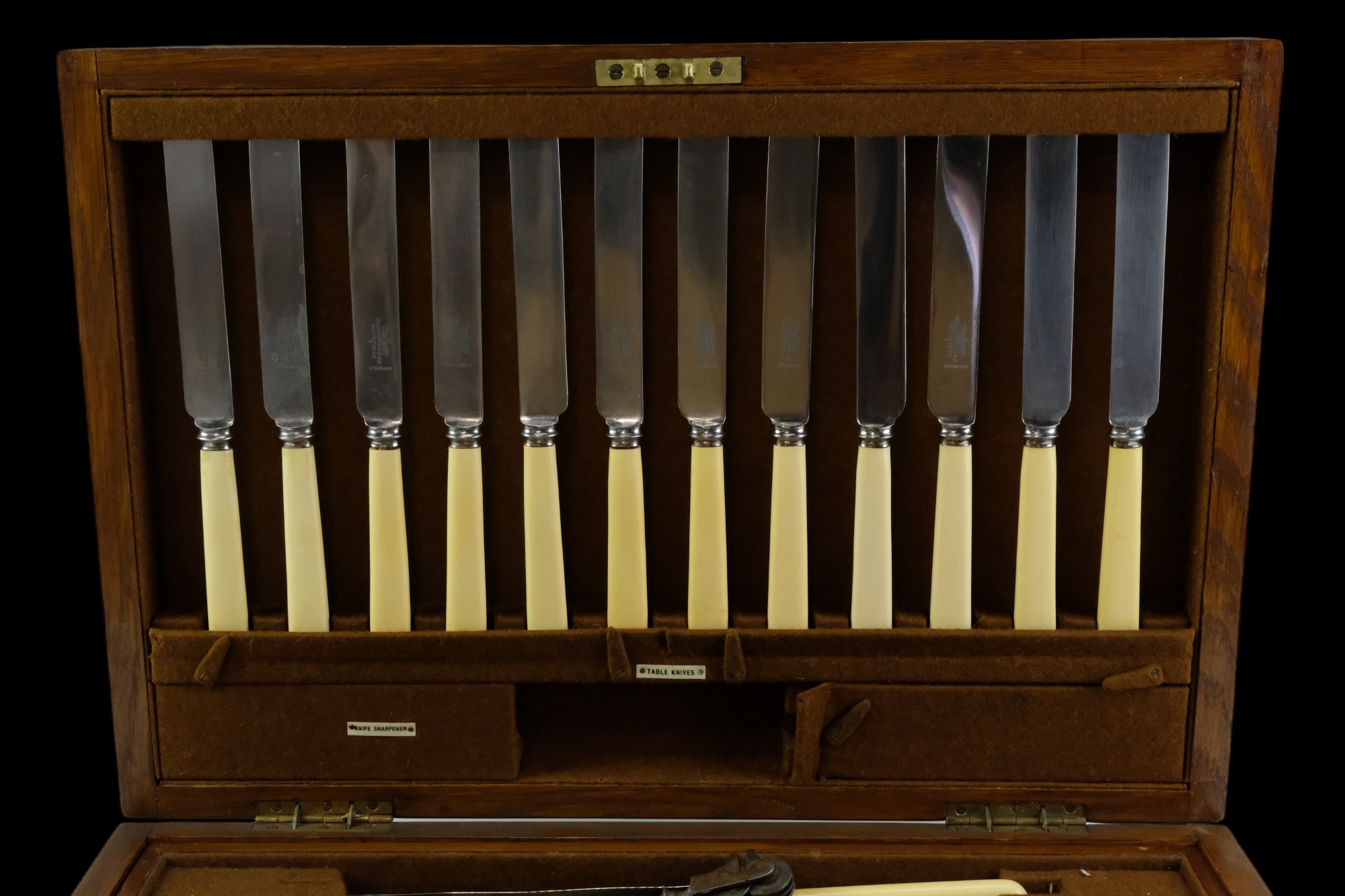 A Mappin & Webb brass-mounted oak canteen containing a suite of Ivorine and electroplate cutlery and - Image 3 of 4