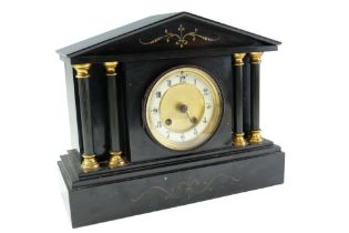 A late 19th Century polished black slate mantel clock, of Palladian architectural form having a