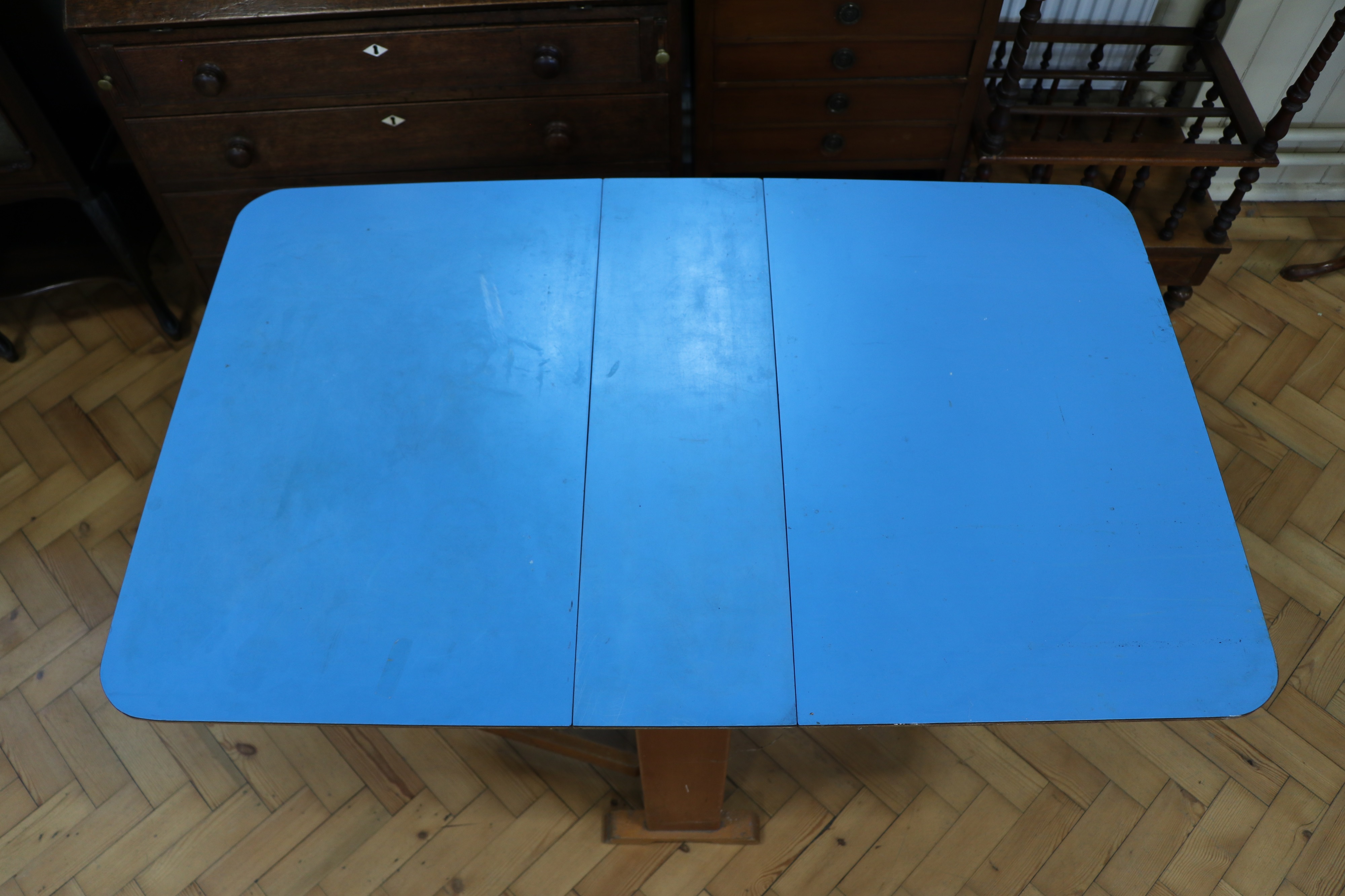 A mid-Century blue Formica topped drop-leaf kitchen table, circa 1950s - 1960s, 75 cm x 119 cm x - Image 2 of 3