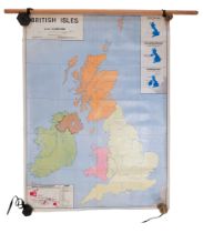 A double-sided educational wall map of The British Isles by Macmillan & Co Ltd, mounted on wooden