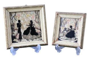A pair of 1920s romantic, reverse painted silhouettes depicting a woman sat writing a letter to