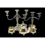 A quantity of early 20th Century and later electroplate comprising two candelabra and a gilt three-