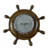 A mid-20th Century aneroid barometer by Shortland Smiths, in the form of a ship's wheel, 27 cm x