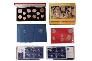 A group of proof coin sets including two boxed Royal Australian Mint 1990 sets, 1999 and 2000 United