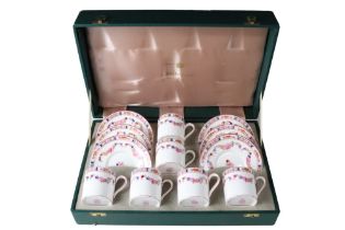 A cased set of six Minton Rose hand painted coffee cans and saucers, mid-to-late 20th Century, (A-