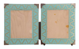 A pair of Art Deco influenced photograph frames, each having an oblong glass with printed gold and