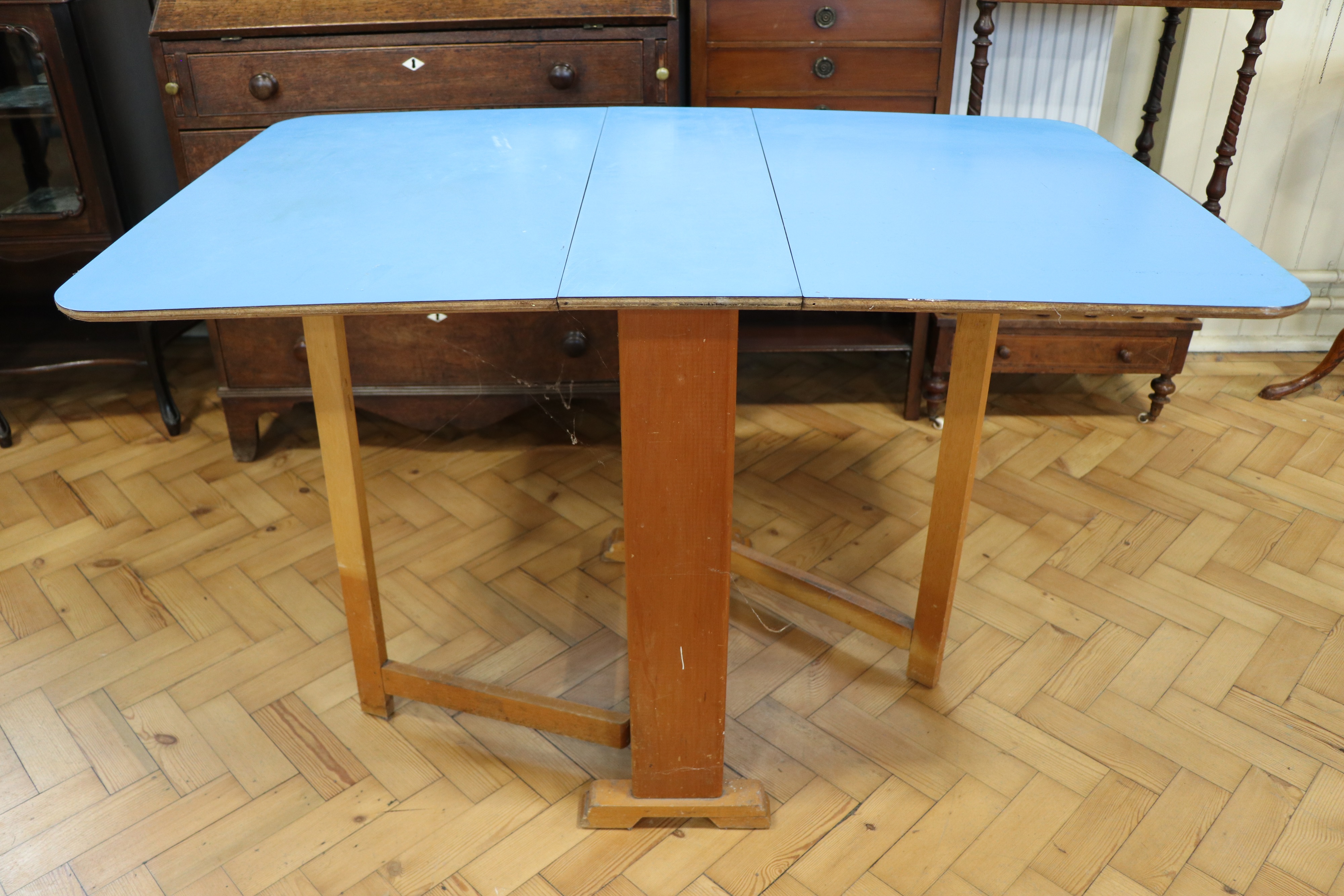 A mid-Century blue Formica topped drop-leaf kitchen table, circa 1950s - 1960s, 75 cm x 119 cm x - Image 3 of 3