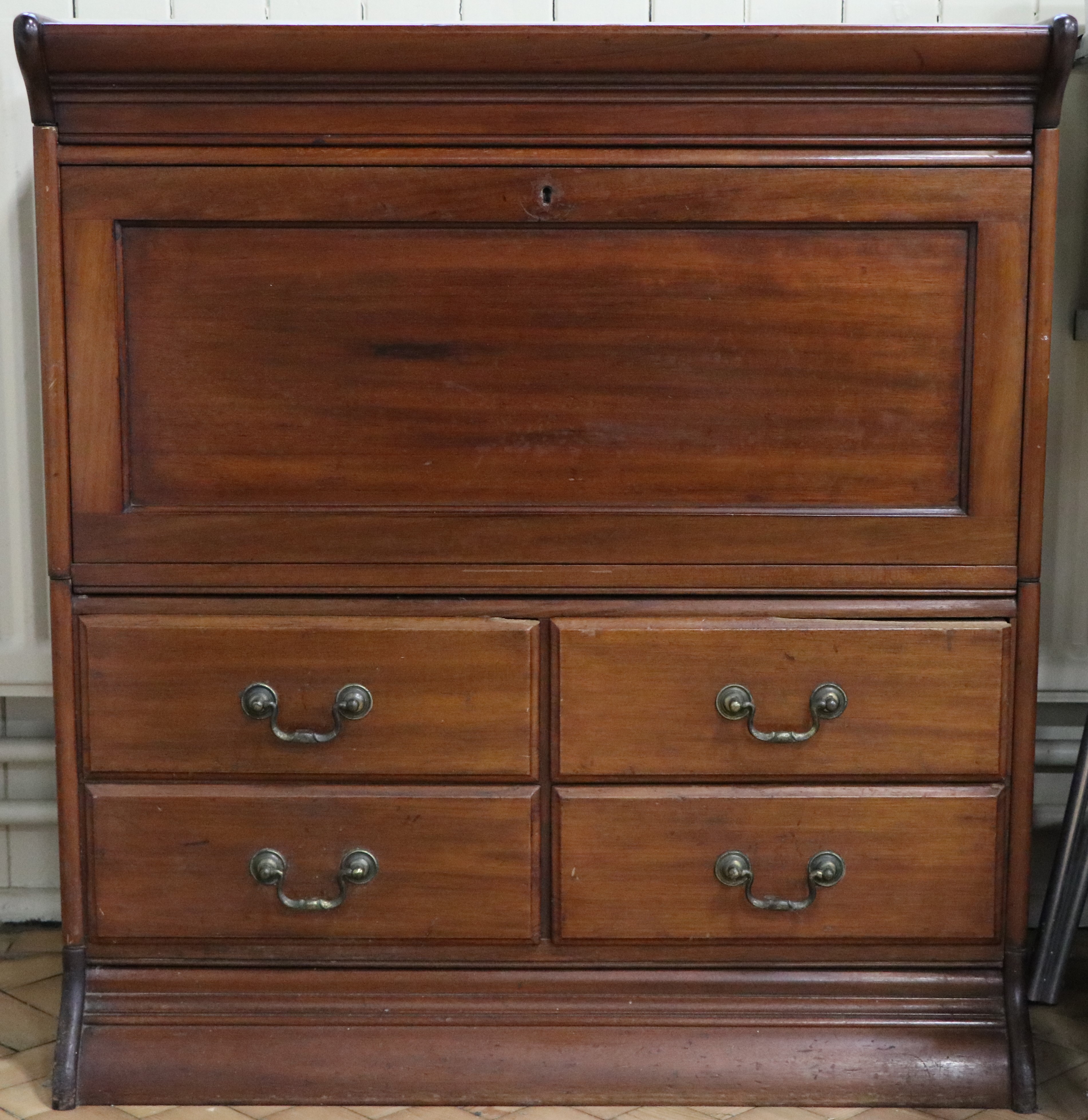 A 1920s Globe-Wernicke mahogany sectional pediment, fall-front bureau stage, drawers and base