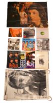 A large quantity of vintage and later posters and calendars pertaining to The Beatles, John