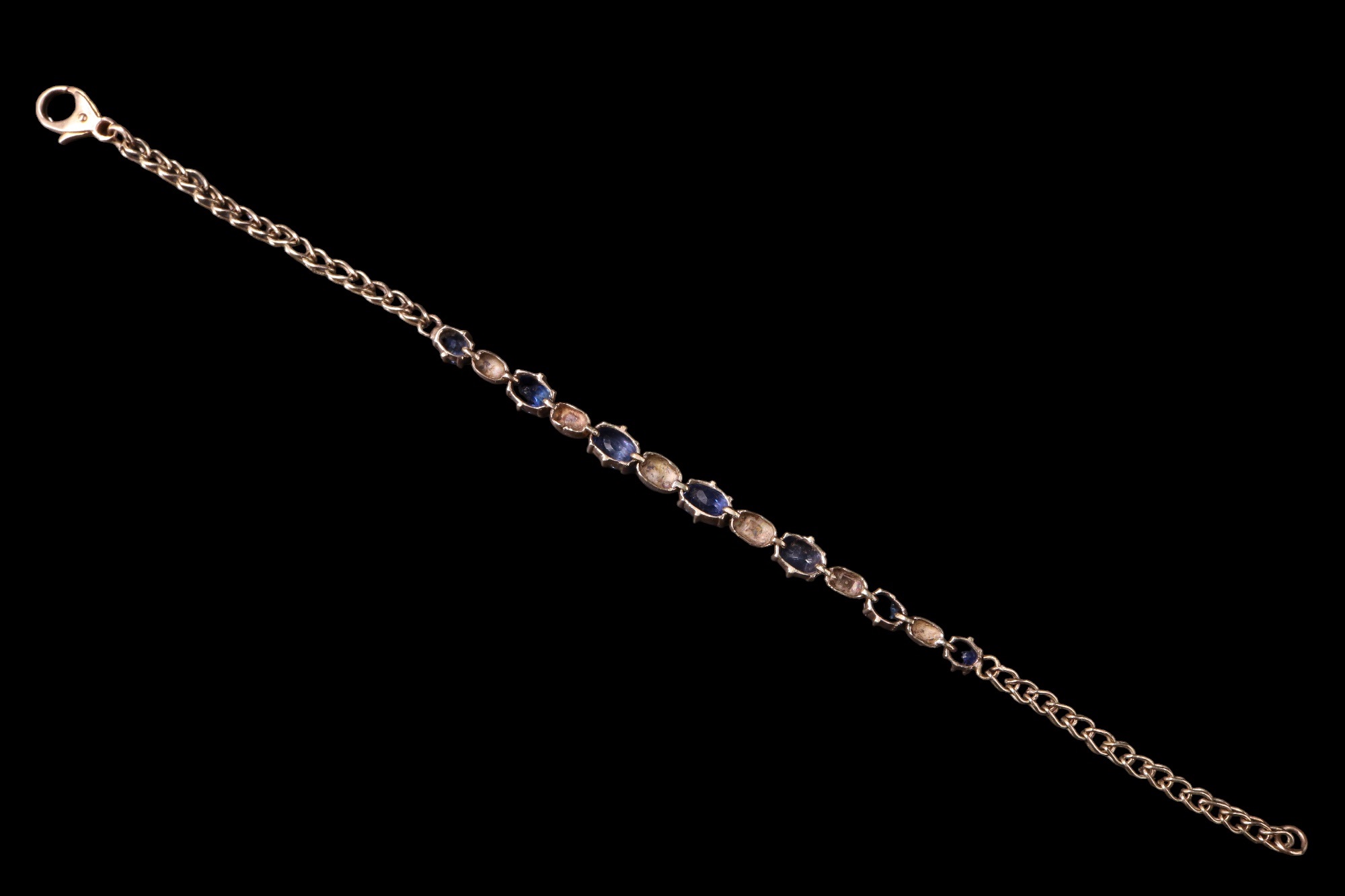 A sapphire and diamond bracelet, having seven graduated oval sapphires of approximately 3 carats - Image 3 of 3