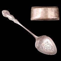 A Victorian silver preserve spoon together with a George V silver napkin ring, sponsors marks