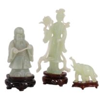 Three late 20th Century Chinese carved jade figurines of Shou Xing, Guanyin and an elephant, on
