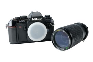 A 1980s Nikon F301 35 mm film camera mounted with an F1:4.5 lens