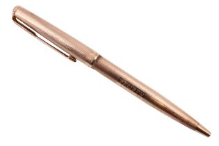 A Parker 9 ct gold ballpoint pen, having a linear-engine-turned body, London, 1970, 14.7 g excluding