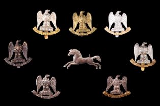 A collection of Royal Scots Greys cap badges