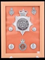 A collection of North Yorkshire Police badges and insignia