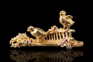 A late Victorian naturalistic brooch, finely modelled in high-carat gold depicting a bird pecking at