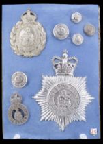 A collection of Huddersfield Police badges and insignia