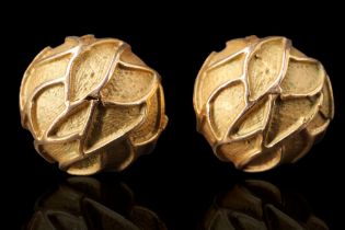 A pair of 1970s 9 ct gold stud earrings each of hemispherical form decorated with organic trails,