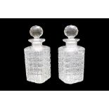 A pair of mid 20th Century traditional cut glass spirit decanters, 22 cm