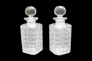 A pair of mid 20th Century traditional cut glass spirit decanters, 22 cm