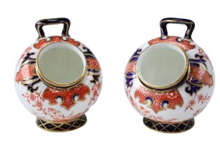 A pair of early 20th Century Royal Crown Derby Imari pattern salt pigs, height 8 cm
