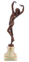 An Art Deco style bronzed brass sculpture of a dancer, on an onyx socle, 24 cm