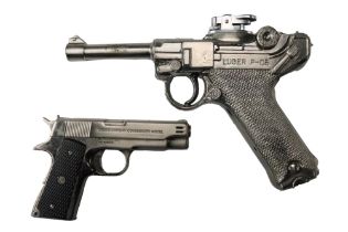 A novelty Luger P-08 pistol cigarette lighter together with a Colt MK IV