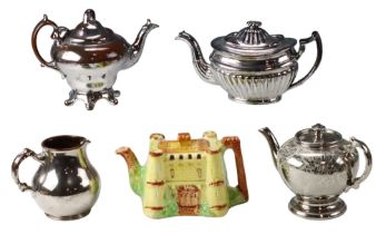 Three Victorian silver lustreware tea pots together with a jug and castle tea pot