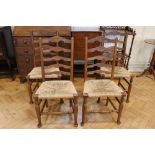 Four late 19th / early 20th Century rush-seated oak ladder-back chairs, 95 cm