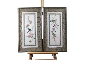 A pair of Chinese embroidered silks depicting birds amongst blossom, mid 20th Century, uniformly