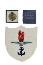 An RAF Swimming Association embroidered badge and enamelled bronze prize medallion