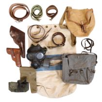 A quantity of military accoutrements including leather and webbing holsters